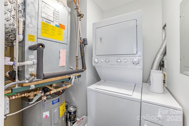 333 W Trade St Unit 1500, Charlotte, NC 28202 - washroom featuring stacked washer / drying machine and heating unit