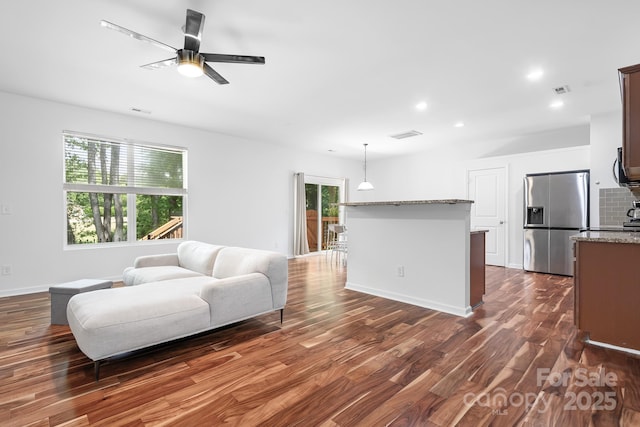 9437 Macquarie Ln, Charlotte, NC 28227 - living area featuring dark wood-style floors, ceiling fan, recessed lighting, and baseboards