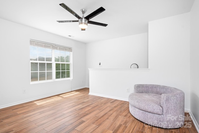 9437 Macquarie Ln, Charlotte, NC 28227 - living area with wood finished floors, a ceiling fan, and baseboards