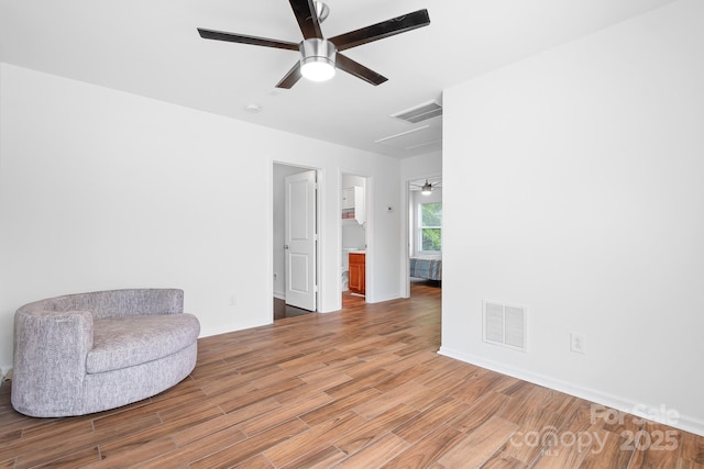 9437 Macquarie Ln, Charlotte, NC 28227 - sitting room featuring a ceiling fan, wood finished floors, and baseboards