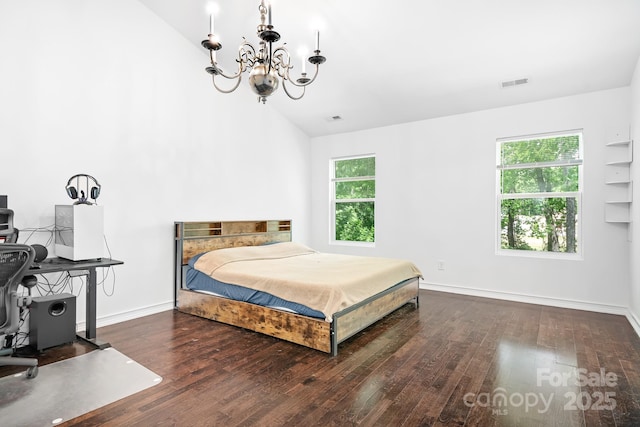 9437 Macquarie Ln, Charlotte, NC 28227 - bedroom with a chandelier, multiple windows, wood finished floors, and lofted ceiling
