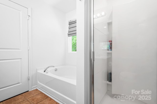 9437 Macquarie Ln, Charlotte, NC 28227 - full bathroom featuring tile patterned flooring, a garden tub, and a shower stall