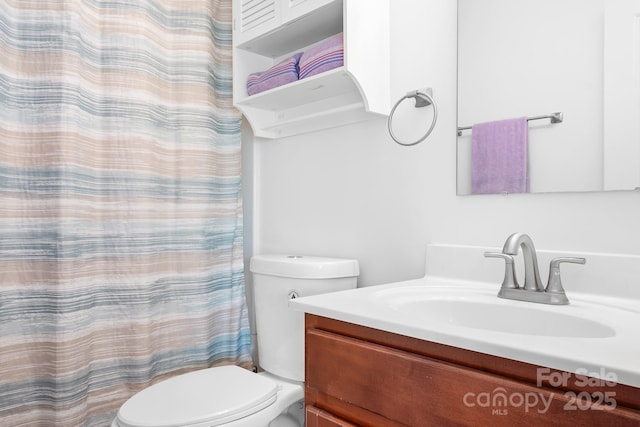 9437 Macquarie Ln, Charlotte, NC 28227 - full bath with toilet, vanity, and a shower with shower curtain