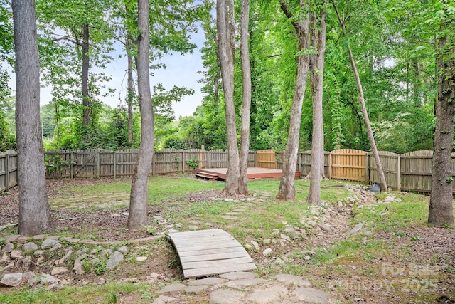 9437 Macquarie Ln, Charlotte, NC 28227 - fenced backyard featuring a wooden deck