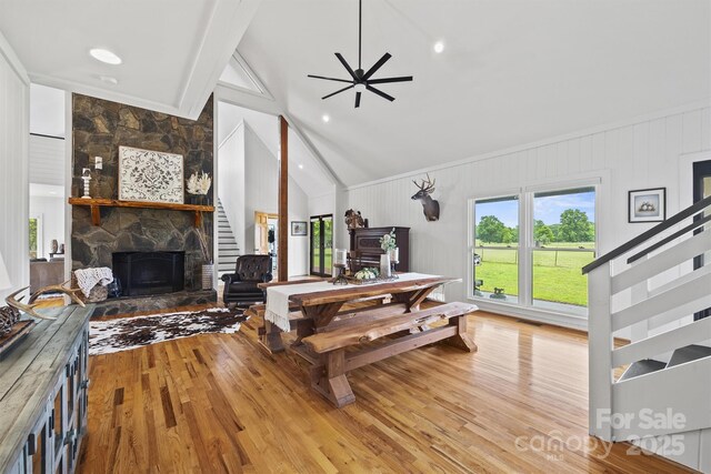 930 Hawley Rd, Mcconnells, SC 29726 - living room with wood finished floors, a stone fireplace, and a ceiling fan