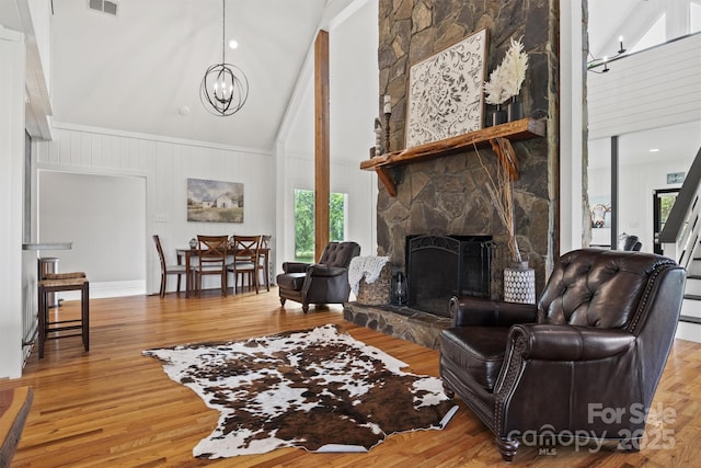930 Hawley Rd, Mcconnells, SC 29726 - living area with a chandelier, high vaulted ceiling, plenty of natural light, a fireplace, and wood finished floors