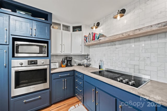930 Hawley Rd, Mcconnells, SC 29726 - kitchen with stainless steel appliances, open shelves, blue cabinetry, and backsplash