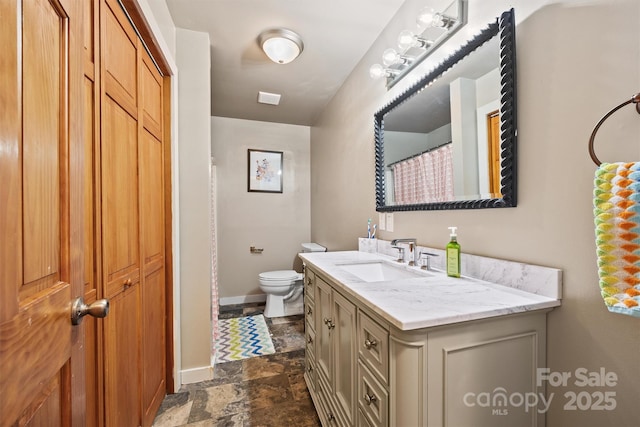 930 Hawley Rd, Mcconnells, SC 29726 - bathroom featuring stone finish flooring, toilet, vanity, and baseboards