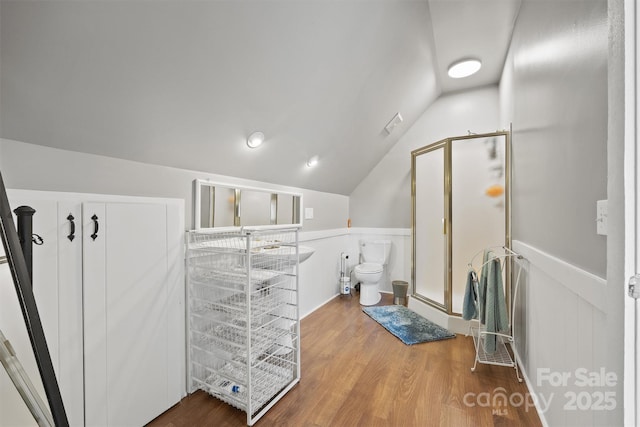 930 Hawley Rd, Mcconnells, SC 29726 - full bath featuring a stall shower, wood finished floors, vaulted ceiling, toilet, and a wainscoted wall