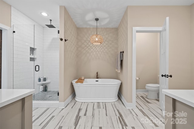 930 Hawley Rd, Mcconnells, SC 29726 - full bathroom with a stall shower, a soaking tub, baseboards, toilet, and vanity