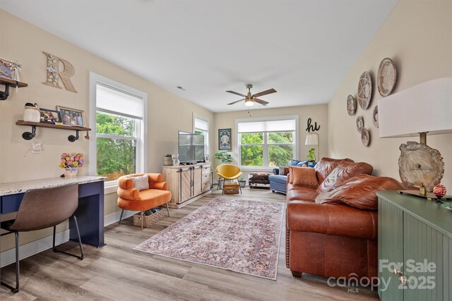 930 Hawley Rd, Mcconnells, SC 29726 - living room with wood finished floors, a ceiling fan, and baseboards