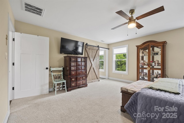 930 Hawley Rd, Mcconnells, SC 29726 - bedroom featuring a barn door, carpet, baseboards, and a ceiling fan