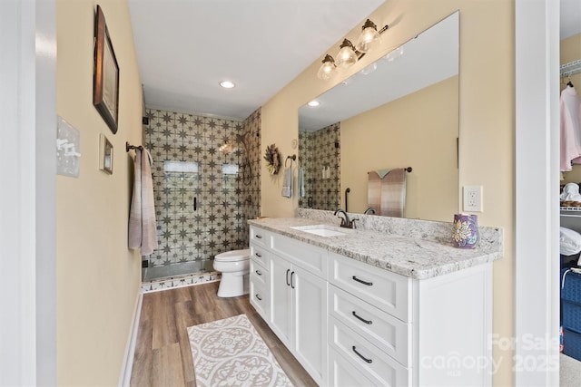 930 Hawley Rd, Mcconnells, SC 29726 - bathroom with a shower stall, toilet, wood finished floors, vanity, and recessed lighting