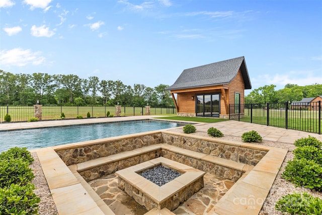 1822 Irby Rd, Monroe, NC 28112 - view of pool with a fire pit, an outdoor structure, a patio area, an exterior structure, and view of scattered trees