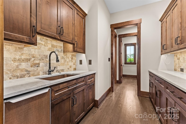 1822 Irby Rd, Monroe, NC 28112 - kitchen with a sink, baseboards, dark wood finished floors, tasteful backsplash, and light countertops