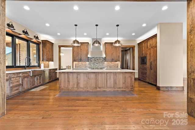 1822 Irby Rd, Monroe, NC 28112 - kitchen featuring wall chimney exhaust hood, stainless steel appliances, light countertops, recessed lighting, and dark wood-style flooring