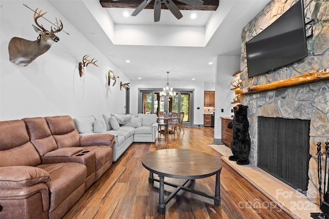 1822 Irby Rd, Monroe, NC 28112 - living room with a tray ceiling, ceiling fan, wood finished floors, recessed lighting, and a chandelier