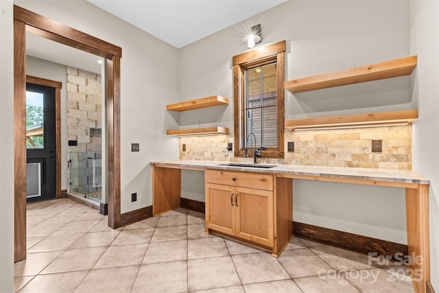 1822 Irby Rd, Monroe, NC 28112 - kitchen with open shelves, a sink, light countertops, tasteful backsplash, and light tile patterned floors