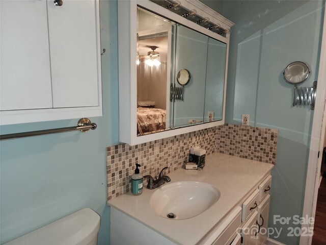 2800 Patio Ln, Gastonia, NC 28056 - ensuite bathroom with backsplash, toilet, and vanity