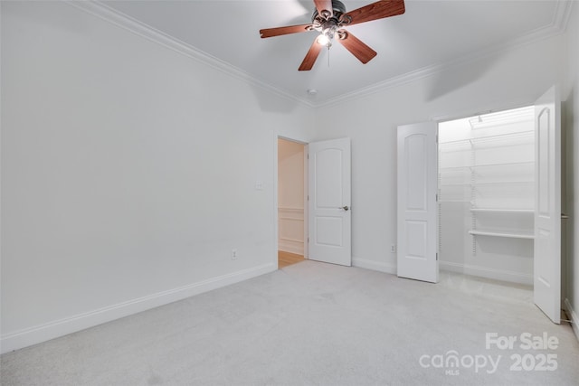 3741 Tea Olive Rd, Gastonia, NC 28056 - unfurnished bedroom with ornamental molding, carpet flooring, a closet, baseboards, and a ceiling fan
