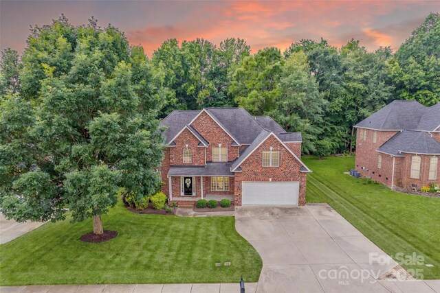 3741 Tea Olive Rd, Gastonia, NC 28056 - traditional home featuring driveway, a garage, brick siding, and a front lawn