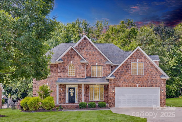 3741 Tea Olive Rd, Gastonia, NC 28056 - traditional home with a front yard, driveway, an attached garage, and roof with shingles