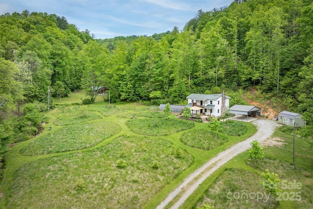 6470 Stone Mountain Rd, Lenoir, NC 28645 - view of yard featuring dirt driveway, a forest view, a wooden deck, and a carport