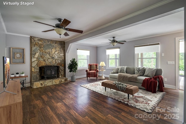 6470 Stone Mountain Rd, Lenoir, NC 28645 - living room featuring a wood stove, wood finished floors, crown molding, baseboards, and a ceiling fan