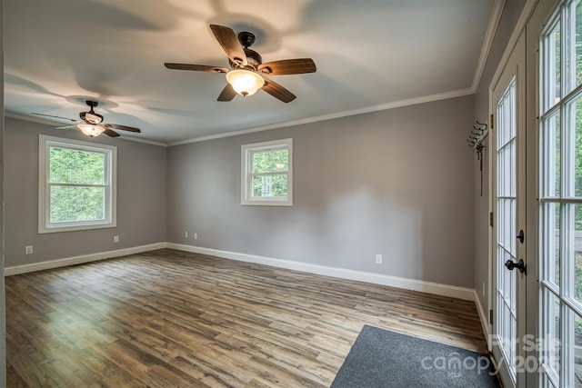6470 Stone Mountain Rd, Lenoir, NC 28645 - spare room featuring baseboards, wood finished floors, ornamental molding, ceiling fan, and french doors
