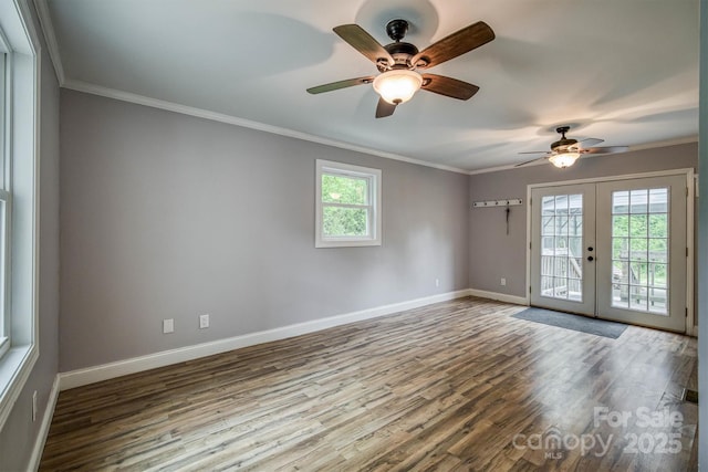 6470 Stone Mountain Rd, Lenoir, NC 28645 - empty room with french doors, healthy amount of natural light, wood finished floors, baseboards, and crown molding