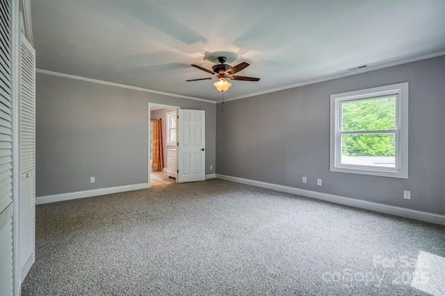 6470 Stone Mountain Rd, Lenoir, NC 28645 - unfurnished bedroom featuring ornamental molding, carpet flooring, baseboards, ensuite bath, and ceiling fan
