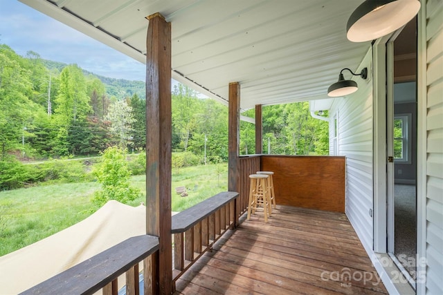 6470 Stone Mountain Rd, Lenoir, NC 28645 - wooden deck with a view of trees and a lawn