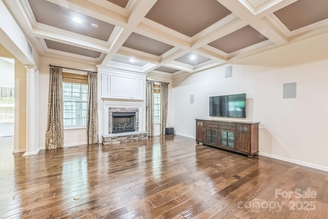 8336 Early Bird Way, Mint Hill, NC 28227 - unfurnished living room featuring decorative columns, wood finished floors, beamed ceiling, a fireplace, and baseboards