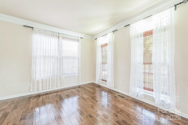 8336 Early Bird Way, Mint Hill, NC 28227 - empty room featuring wood finished floors, crown molding, and baseboards