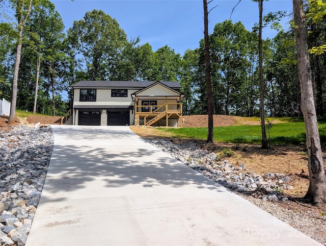 280 Haven Ridge Ln N, Marion, NC 28752 - view of front of property featuring stairs, an attached garage, and concrete driveway