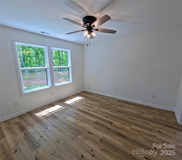280 Haven Ridge Ln N, Marion, NC 28752 - spare room with wood finished floors, ceiling fan, and baseboards