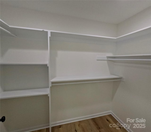 280 Haven Ridge Ln N, Marion, NC 28752 - walk in closet featuring wood finished floors