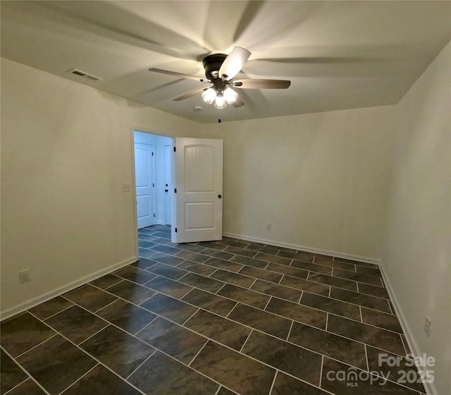 280 Haven Ridge Ln N, Marion, NC 28752 - spare room with a ceiling fan, baseboards, and dark tile patterned floors