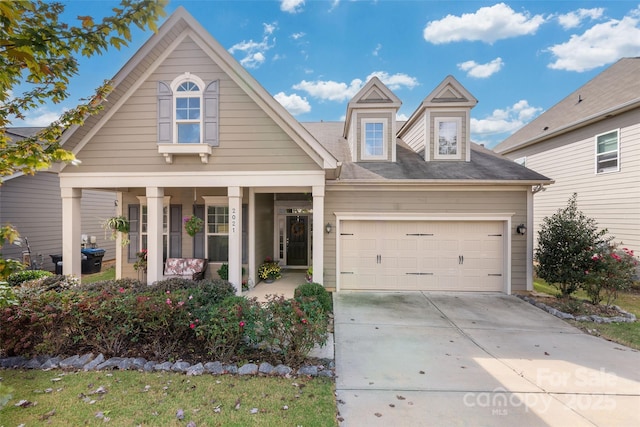 2021 Pinyon Ln, Lancaster, SC 29720 - view of front facade with concrete driveway, an attached garage, and covered porch