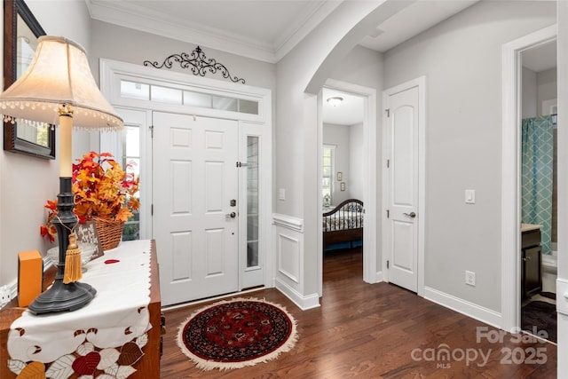 2021 Pinyon Ln, Lancaster, SC 29720 - entrance foyer with arched walkways, dark wood-style flooring, and crown molding