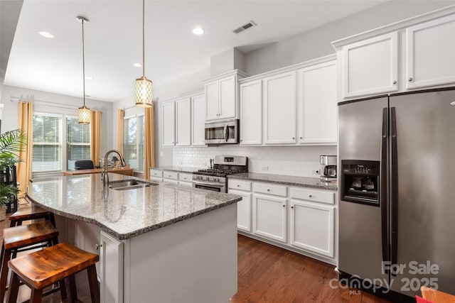 2021 Pinyon Ln, Lancaster, SC 29720 - kitchen with stainless steel appliances, a sink, white cabinets, decorative backsplash, and recessed lighting