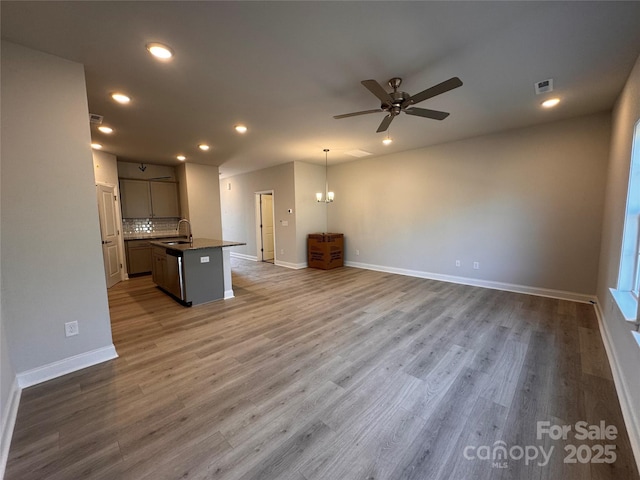 4037 Port Richmond Ave Unit 8, Gastonia, NC 28056 - unfurnished living room featuring a sink, ceiling fan, recessed lighting, baseboards, and wood finished floors