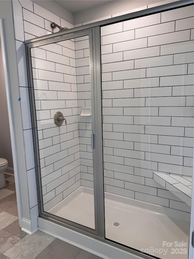 4037 Port Richmond Ave Unit 8, Gastonia, NC 28056 - bathroom featuring toilet and a shower stall