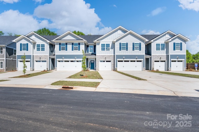 4037 Port Richmond Ave Unit 8, Gastonia, NC 28056 - townhome / multi-family property with driveway, a garage, board and batten siding, and stone siding