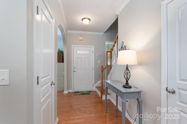 916 Coffee Tree Ln, Rock Hill, SC 29732 - entryway featuring arched walkways, crown molding, light wood-type flooring, stairs, and baseboards