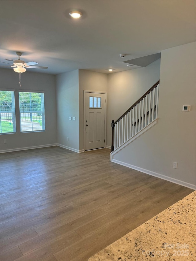 2910 Sloan Dr, Charlotte, NC 28208 - entryway with ceiling fan, baseboards, wood finished floors, stairs, and recessed lighting