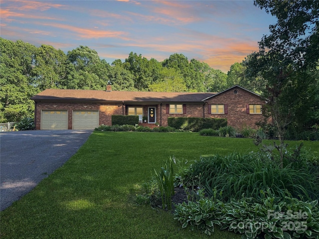 4916 Leepers Creek Rd, Maiden, NC 28650 - single story home with asphalt driveway, brick siding, a garage, a yard, and a chimney