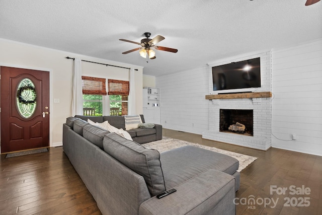 4916 Leepers Creek Rd, Maiden, NC 28650 - living area with a ceiling fan, hardwood / wood-style floors, a brick fireplace, a textured ceiling, and baseboards