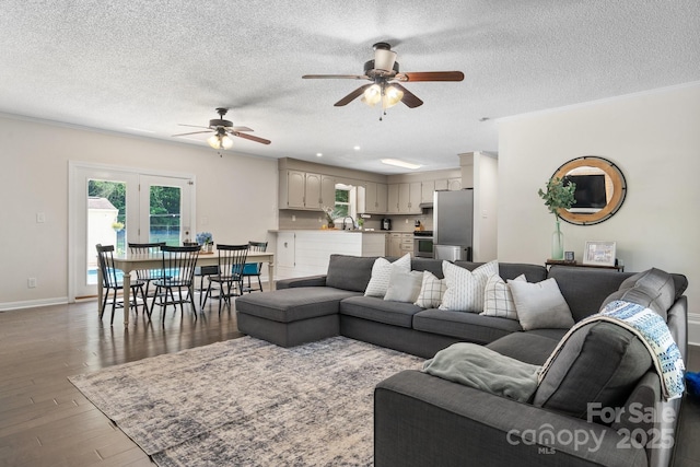 4916 Leepers Creek Rd, Maiden, NC 28650 - living area with a ceiling fan, a textured ceiling, wood finished floors, baseboards, and crown molding