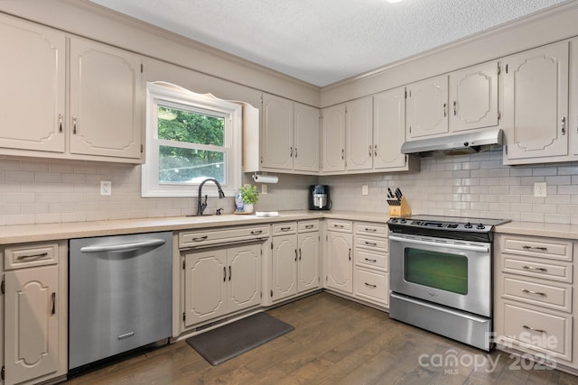 4916 Leepers Creek Rd, Maiden, NC 28650 - kitchen featuring stainless steel appliances, under cabinet range hood, a textured ceiling, dark wood finished floors, and light countertops